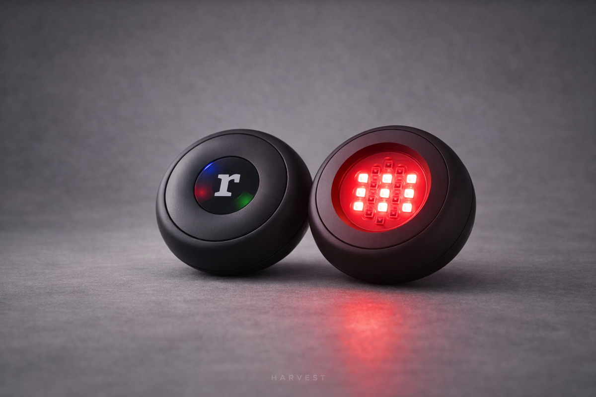 Rubie handheld red light devices showing the control side and illuminated LED face.